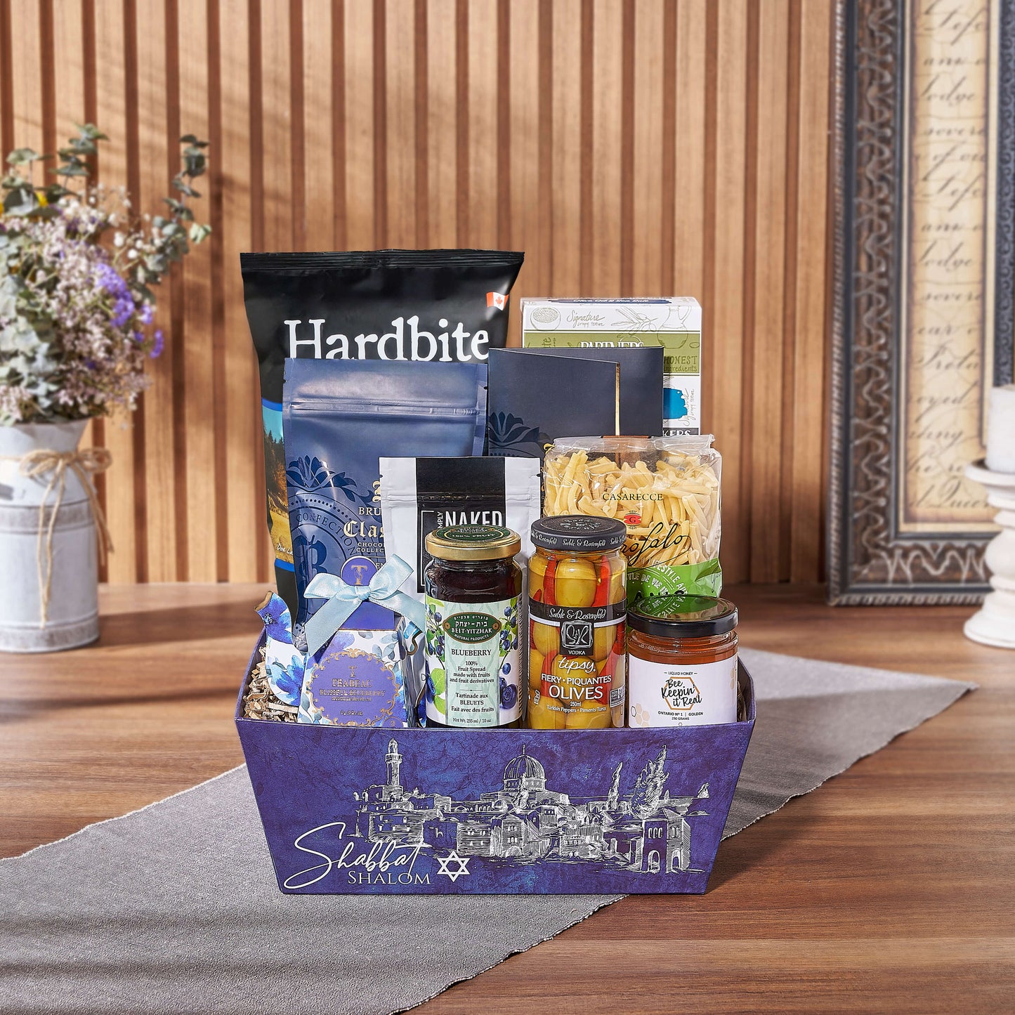 The Basket of Kosher Treats offers a delightful array of snacks, making it an ideal choice for sending your well wishes to a friend, family member, or colleague, Boston delivery