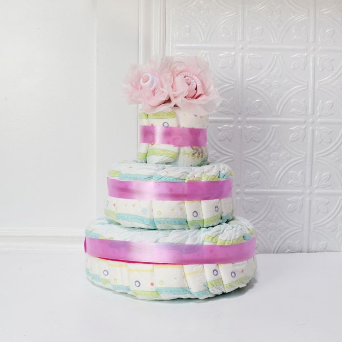 Elegant Baby Shower Diaper Cake Featuring Pink Sock Roses – how the gift is presented
